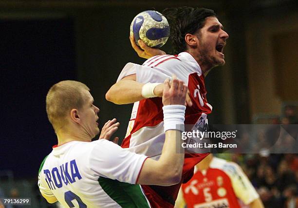 Ivan Brouka of Belarus in action with Laszlo Magy of Hungary during the Men's Handball European Championship Group C match between Hungary and...