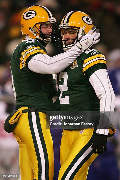 Kicker Mason Crosby of the Green Bay Packers is congratulated by his teammate Jon Ryan after Crosby made a 37-yard field goal against the New York...