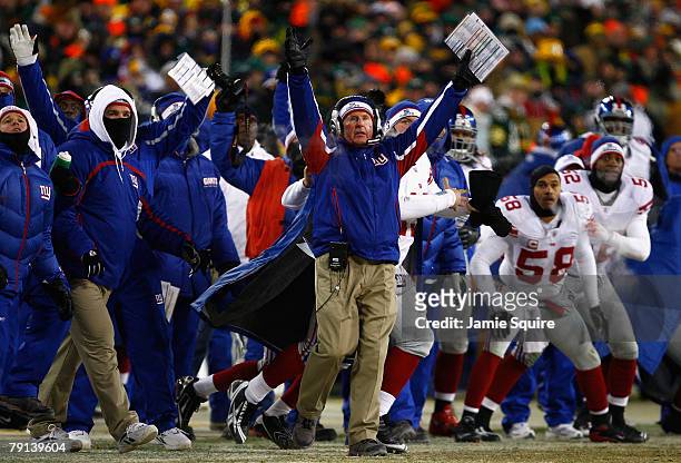 Head coach Tom Coughlin and the New York Giants celebrate as the winning field goal is kicked in overtime of the NFC championship game against the...