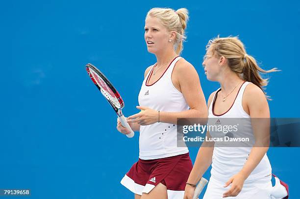 Isabella Holland and Sally Peers of Australia talk tactics during their junior doubles against Simona Halep of Romania and Katarzyna Piter of Poland...