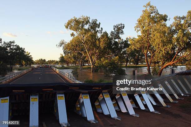 The Mitchell Highway is cut off by flood waters and a man made barrier has been built to try an prevent further flooding in the Central Queensland...