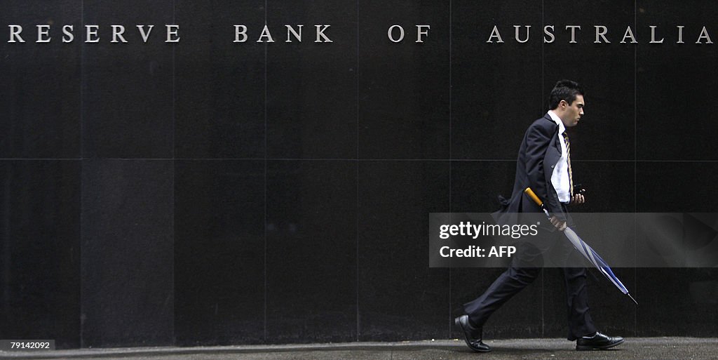 A man walks along the Reserve Bank of Au
