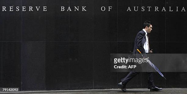 Man walks along the Reserve Bank of Australia at Sydney, 21 January 2008. Boom in Asia and bust in the United States are buffeting Australia's...