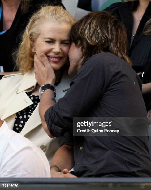 Actress Nicole Kidman and her husband singer Keith Urban arrive to watch the fourth round match against Lleyton Hewitt of Australia and Novak...