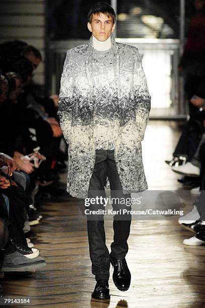 Model walks the runway during the Raf Simons Menswear fashion show as part of Paris Fashion Week Fall/Winter 2008/2009 on January 19, 2008 in Paris,...