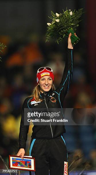 Anni Friesinger of Germany with her flowers and picture after winning the ladies 1000m race during the first day of the World sprint speed skating...