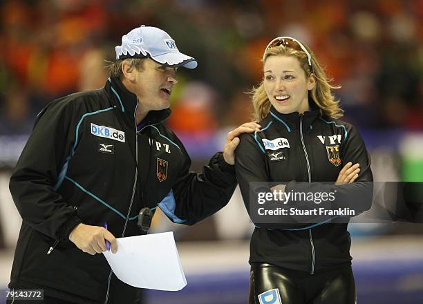 Heike Hartmann of Germany talks with a coach during the first day of the World sprint speed skating Championships on January 19, 2008 in Heerenveen,...