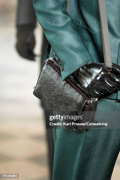 Model carries a bag as he walks the catwalk during the Lanvin Menswear fashion show part of Paris Fashion Week Fall/Winter 2008/2009 on January 20,...