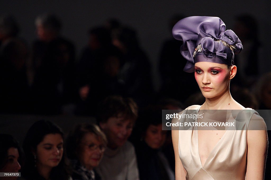 A model presents a creation by French de