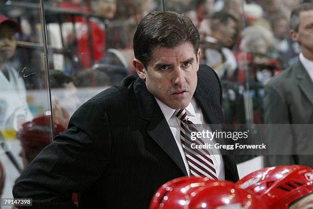 Peter Laviolette head coach of the Carolina Hurricanes watches the action against the Edmonton Oilers during the NHL game at RBC Center on January...