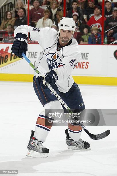 Sheldon Souray of the Edmonton Oilers passes the puck during the NHL game against the Carolina Hurricanes at RBC Center on January 18, 2008 in...