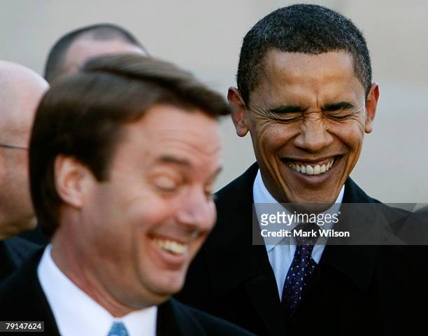 Presidential candidates U.S. Sen. Barack Obama and former U.S. Sen. John Edwards laugh before being introduced during a rally to remember Martin...