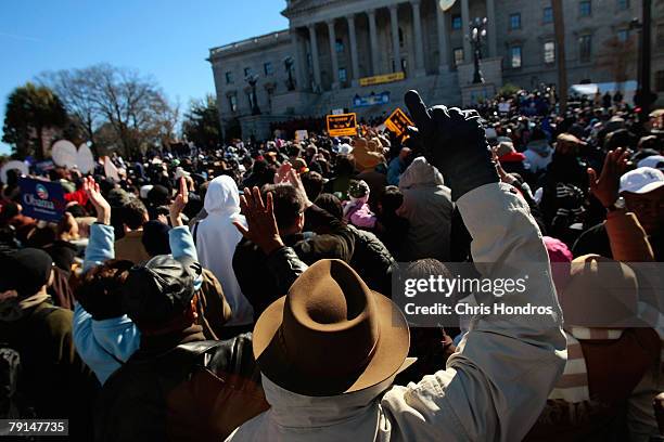 People cheer during a Martin Luther King day rally on the grounds of the South Carolina State House January 21, 2008 in Columbia, South Carolina. All...