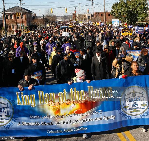 People participate in a march to the State Capitol builfing to honor Martin Luther King, January 21, 2008 in Columbia, South Carolina. Today is a...