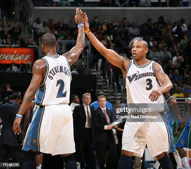 Caron Butler and DeShawn Stevenson of the Washington Wizards celebrate after a basket against the Dallas Mavericks at the Verizon Center on January...