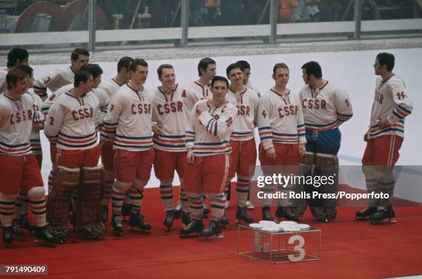 View of the bronze medal winning Czechoslovakia ice hockey team pictured together standing on the medal podium after finishing in 3rd place in the...