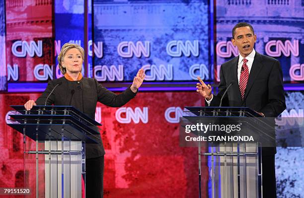 Democratic presidential hopeful New York Senator Hillary Rodham Clinton and Illinois Senator Barack Obama exchange words during the Democratic...