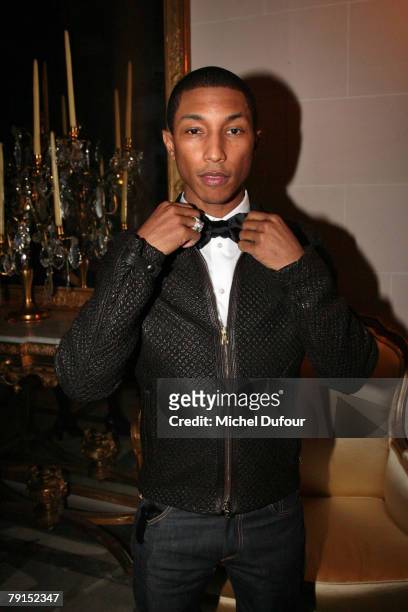 Recording artist Pharrell Williams attends the Louis Vuitton unveiling of a new collection of Blason fine jewelry designed by Pharrell Williams and...