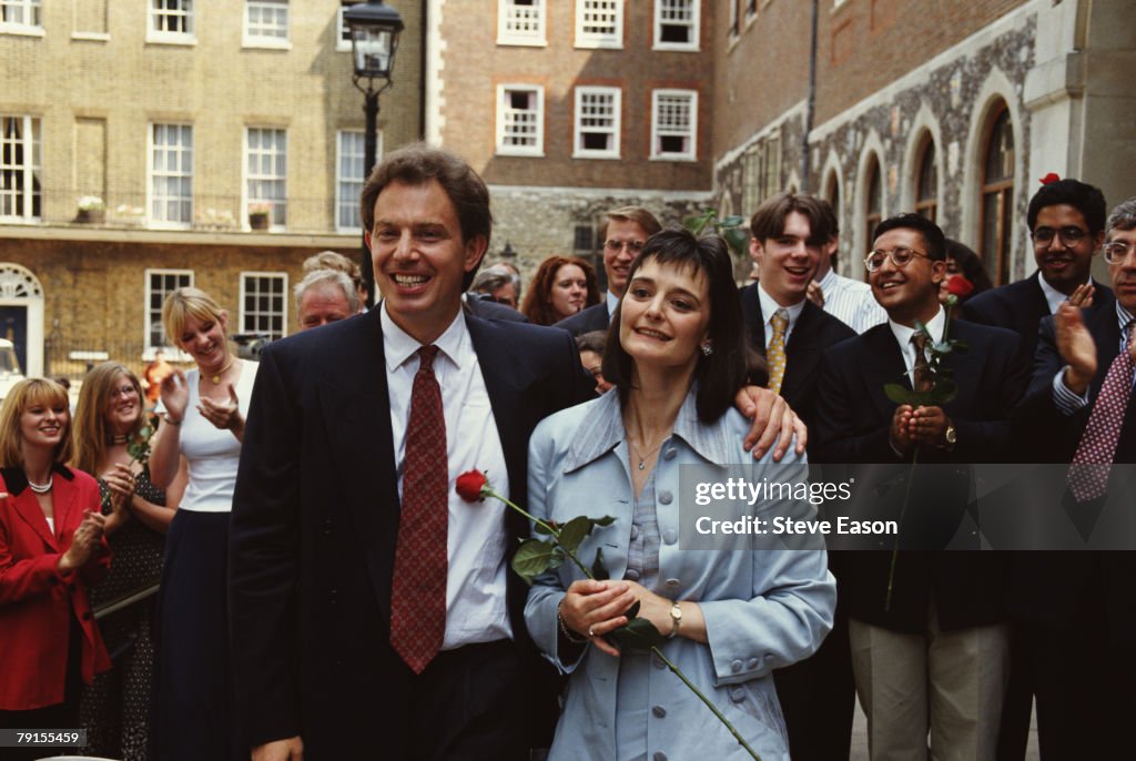 Politician Tony Blair and his wife Cherie celebrate on the day he was