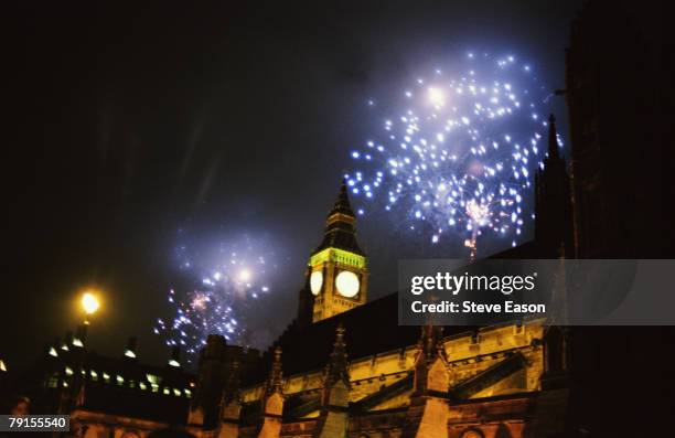 Blue fireworks exploding over the Houses of Parliament and Big Ben as part of New Year's Eve celebrations to mark the new Millenium, 31st December...