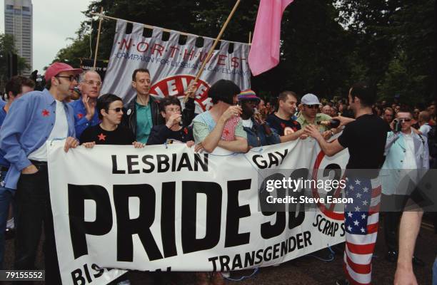 Comedian Rhona Cameron and political activist Peter Tatchell help to hold a banner at the Lesbian, Gay, Bisexual, and Transgender Pride event,...