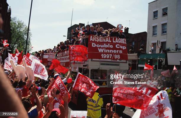The Arsenal Ladies team taking part in an open top bus parade through the streets of Highbury to celebrate their victory in the League and FA Cup,...
