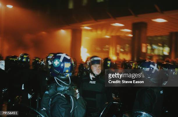 Police in riot gear attend a disturbance outside the Railtrack headquarters, Euston Station, at an anti World Trade Organisation protest during a...