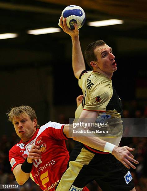 Gudjon Valur Sigurdsson of Iceland is seen in action with Holger Glandorf of Germany during the Men's Handball European Championship main round Group...