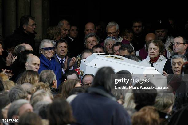 The coffin is carried away from the St Germain church after the funeral mass of singer Carloson January 22, 2008 in Paris, France.