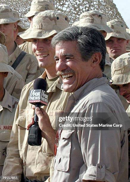 Geraldo Rivera from the Fox News Channel smiles for the camera as he chats with Sgt. Johnny Huff, of Richmond, Virginia, during a live broadcast of...