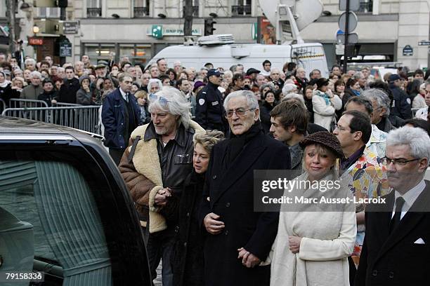 Hughes Aufray helps a Carlos family member to walk as they arrive at St Germain church to attend the funeral mass of singer Carlos in Paris, France...