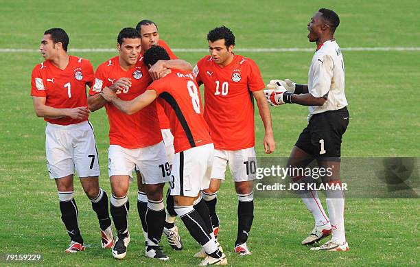 Cameroon's goalkeeper Idris Carlos Kameni protests as Egypt's players celebrate a goal to 1-0 from a penalty scored by Abdel Moteleb Abdrabou 22...