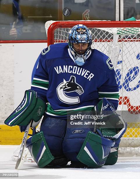 Roberto Luongo of the Vancouver Canucks makes a save during their game against the New York Islanders at General Motors Place on January 8, 2008 in...