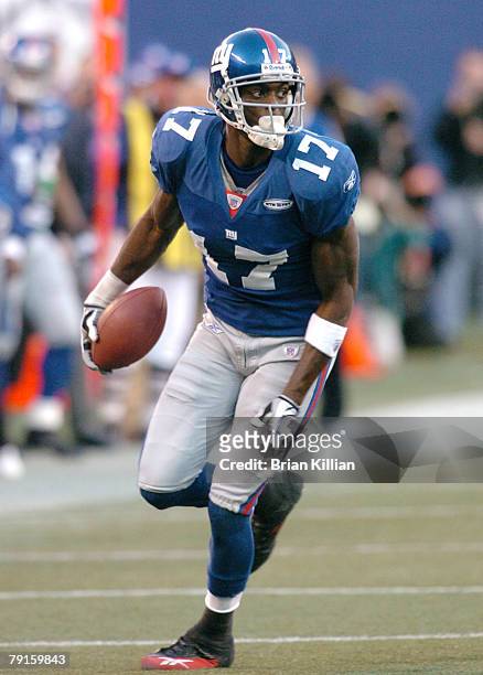 New York Giants wide receiver Plaxico Burress with a catch against the Philadelphia Eagles at Giants Stadium in East Rutherford, NJ on November 20,...