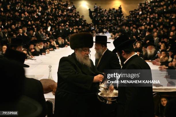 The ultra-Orthodox rabbi of the Belz Hasidim washes his hands before the start of the celebration of the Jewish feast of 'Tu Bishvat' or Tree New...