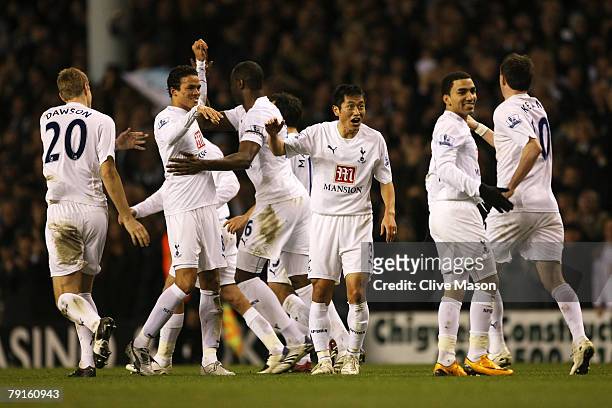 Jermaine Jenas, Young-Pyo Lee and Aaron Lennon of Tottenham celebrate Nicklas Bendtner of Arsenal own goal for Tottenham's 2nd during the Carling Cup...
