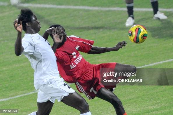 Sudan's Gibril Alaeldin Ahmed holds back Zambia's Jacob Mulenga 22