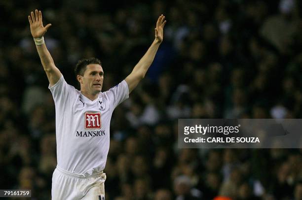 Tottenham's Robbie Keane celebrates after scoring the third goal of the match during the second leg of their Carling Cup Semi Final against Arsenal...
