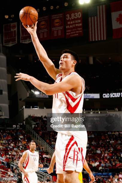 Yao Ming of the Houston Rockets goes up for a shot during the game against the New Orleans Hornets on January 13, 2008 at the Toyota Center in...