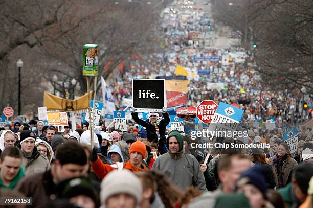 Thousands of anti-abortion demonstrators participating in the "March for Life" walk up to Capitol Hill along Constitution Avenue on their way to the...