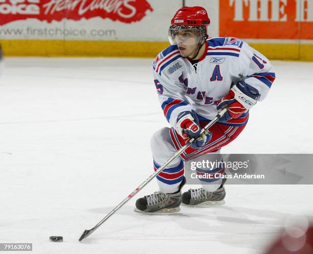 Justin Azevedo of the Kitchener Rangers carries the puck in a game against the London Knights on January 20, 2008 at the John Labatt Centre in...
