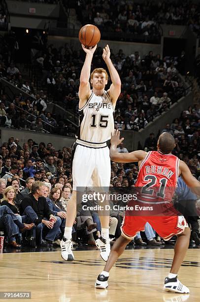 Matt Bonner of the San Antonio Spurs shoots a jump shot over Chris Duhon of the Chicago Bulls during the game at the AT&T Center on December 26, 2007...