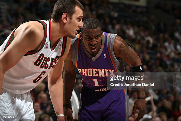 Amare Stoudemire of the Phoenix Suns matches up against Andrew Bogut of the Milwaukee Bucks at the Bradley Center on January 22, 2008 in Milwaukee,...