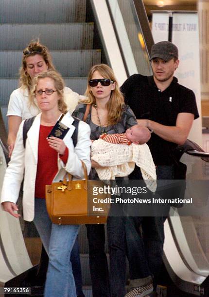 Actor Heath Ledger with wife Michelle Williams and daughter Matilda Rose Ledger leave Sydney International Airport for their New York home on January...
