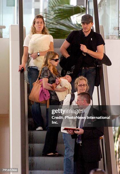 Actor Heath Ledger with wife Michelle Williams and daughter Matilda Rose Ledger leave Sydney International Airport for their New York home on January...