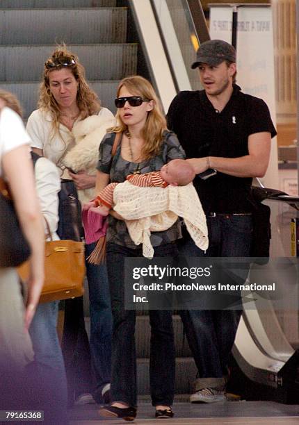 Actor Heath Ledger with wife Michelle Williams and daughter Matilda Rose Ledger leave Sydney International Airport for their New York home on January...