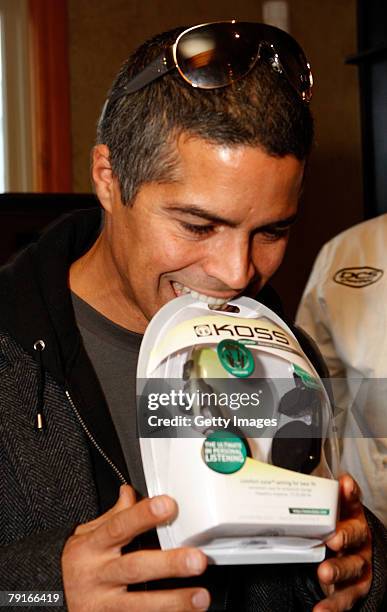 Actor Esai Morales poses with the Koss display at the Gibson Guitar celebrity hospitality lounge held at the Miners Club during the 2008 Sundance...
