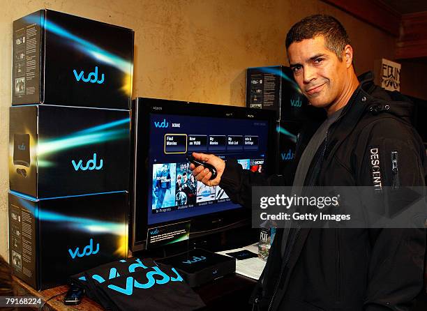 Actor Esai Morales poses with the Vudu display at the Gibson Guitar celebrity hospitality lounge held at the Miners Club during the 2008 Sundance...