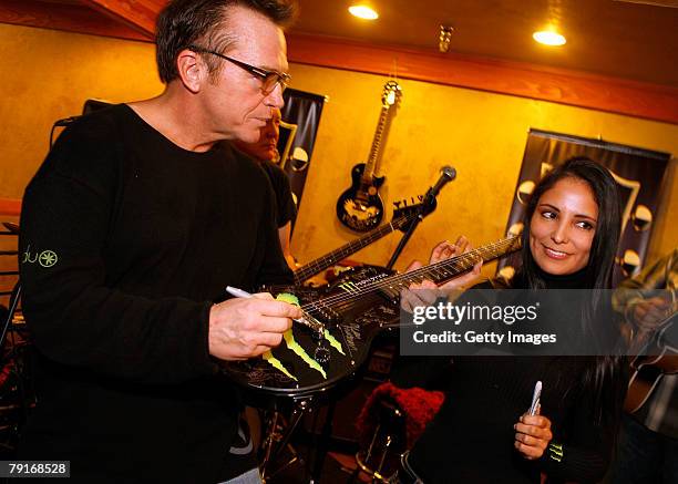 Actor Tom Arnold poses with the Monster display at the Gibson Guitar celebrity hospitality lounge held at the Miners Club during the 2008 Sundance...