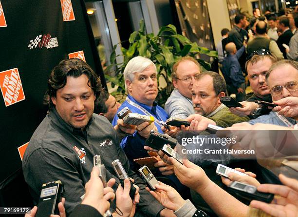 Members of the media surround Tony Stewart, driver of the Home Depot Camry during an event at Joe Gibbs Racing January 22, 2007 in Huntersville,...